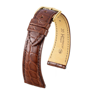 HIRSCH REGENT Klockarmband REGENT-modellen är en högkvalitativ allroundarmband för den krävande kunden. Detta klassiskt vackra armband i alligatorläder kommer garanterat att ge sin bärare nöje under lång tid.
